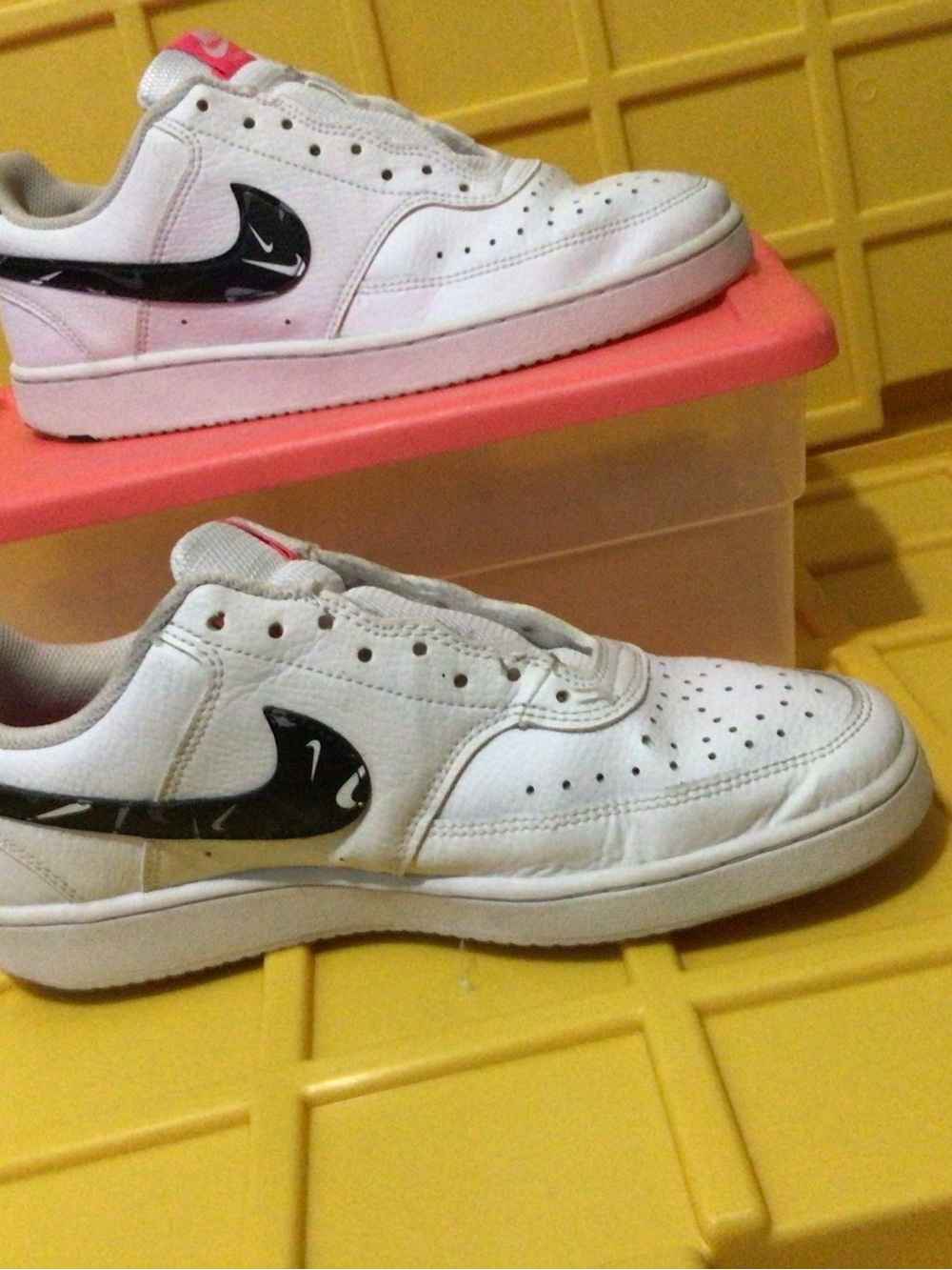 Nike White Kids Sneakers with Black Swoosh and Pink Tongue Accent